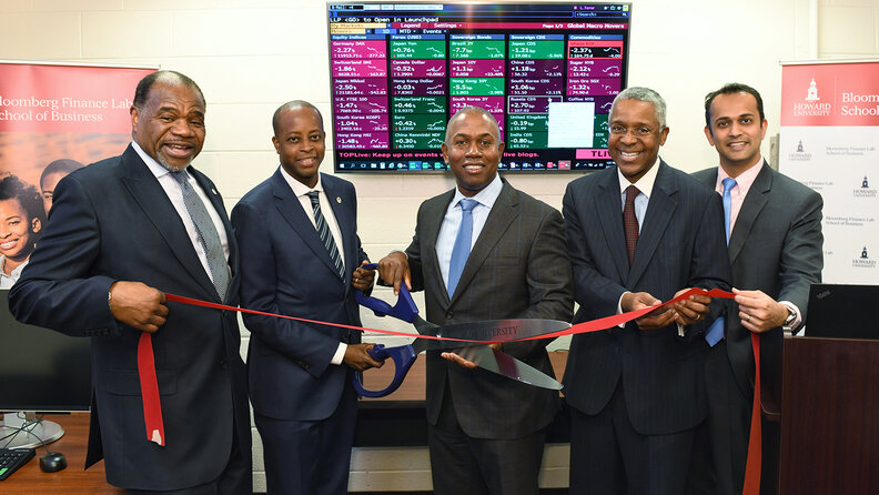 Photo by: Justin Knight/Howard University Helping to open Howard University's new Bloomberg Finance Lab are (from left) Barron H. Harvey and Wayne A. I. Frederick, both of Howard University; Channing Capital Management's Wendell E. Mackey; Howard's Norman K. Jenkins; and Bloomberg's Paras Doshi.